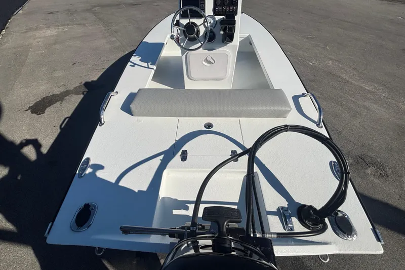 Slide: The Image of Custom FS 14 boat, 2025 model, featuring a sleek white deck and modern steering console. - 10