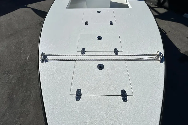 Slide: The Image of Custom FS 14 boat deck, 2025 model, featuring storage hatches and rope cleats. - 14