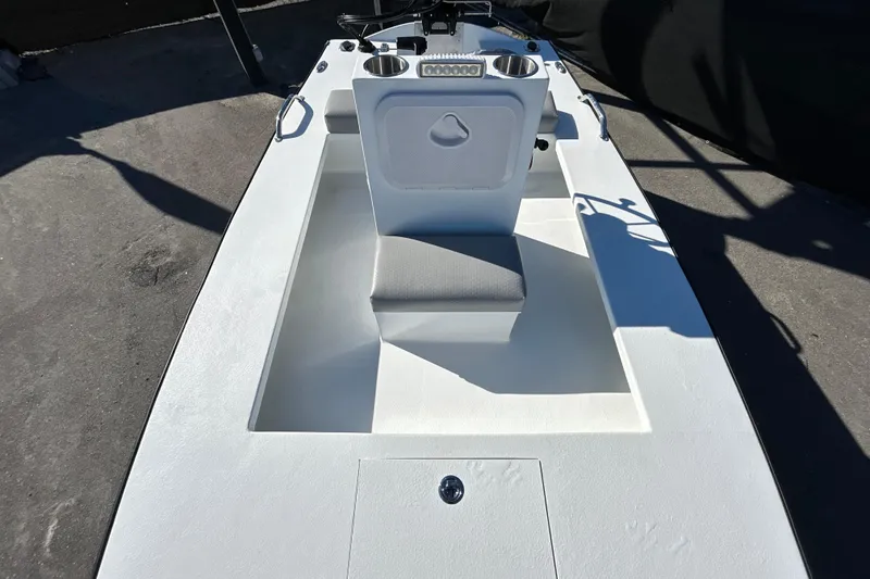 Slide: The Image of Custom FS 14 boat interior, 2025 model, featuring a sleek white design and seating area. - 17
