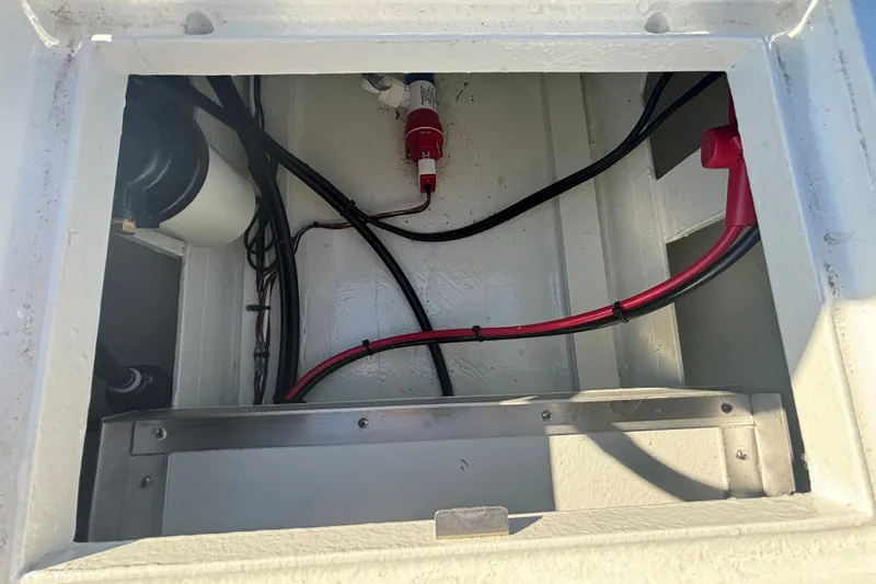 Slide: The Image of Custom FS 14 (2025) boat compartment with wiring and components. - 23