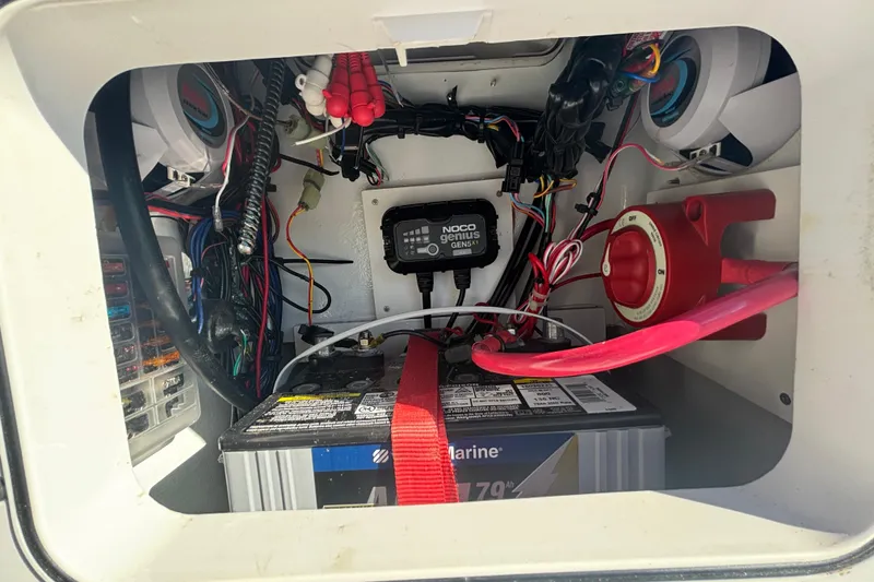 Slide: The Image of Electrical compartment of Custom FS 14, 2025 model, featuring marine battery and wiring setup. - 26