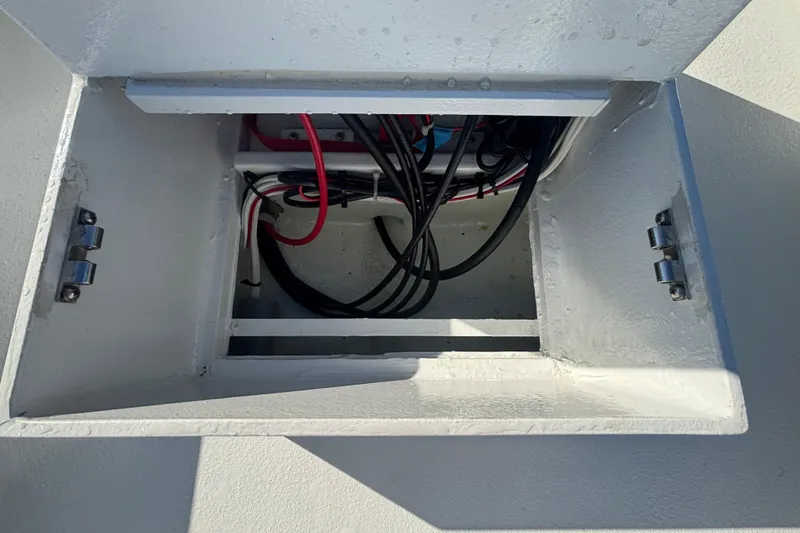 Slide: The Image of Open compartment with wiring in a Custom FS 14, 2025 model. - 32