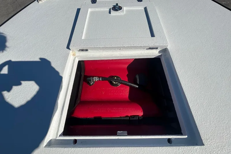 Slide: The Image of Open hatch on Custom FS 14 boat, revealing red compartment, 2025 model. - 34