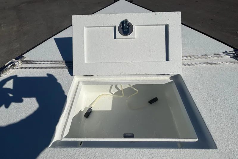 Slide: The Image of Open hatch on Custom FS 14 boat, 2025 model, with visible interior compartment. - 37