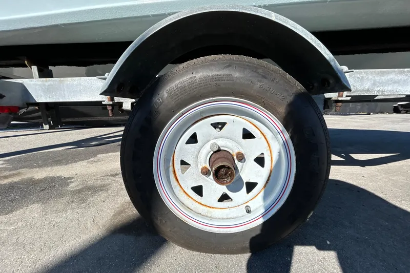 Slide: The Image of Close-up of a Custom FS 14 trailer wheel, 2025 model, on a sunny day. - 42