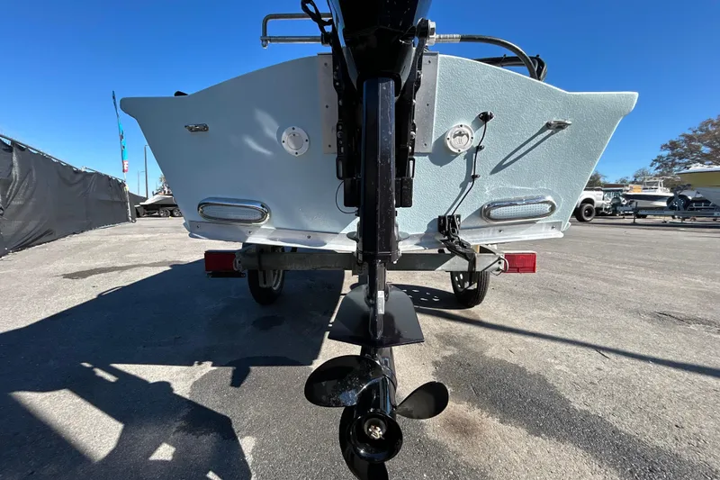 Slide: The Image of Rear view of 2025 Custom FS 14 boat on trailer, showcasing propeller and hull design. - 5