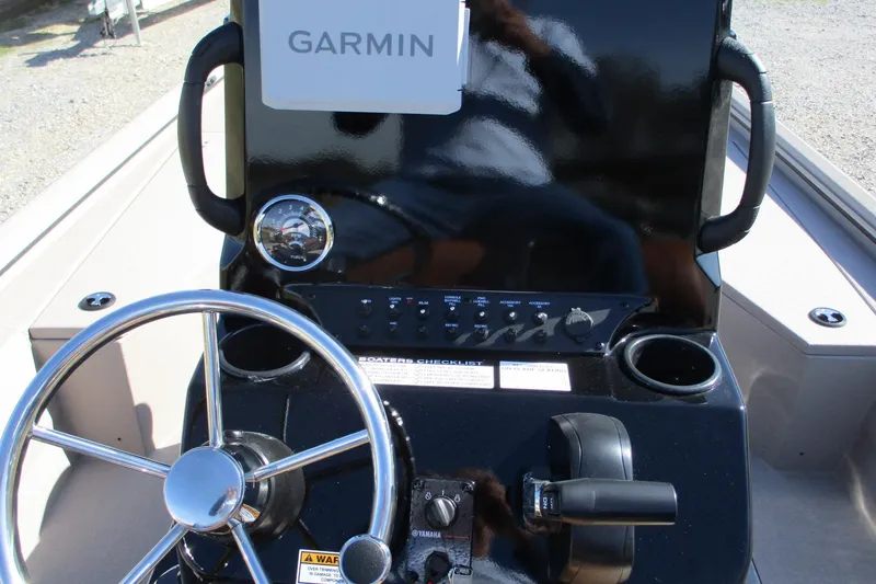 Slide: The Image of Steering console of 2026 Avid 207 Recon boat with Garmin navigation system. - 11