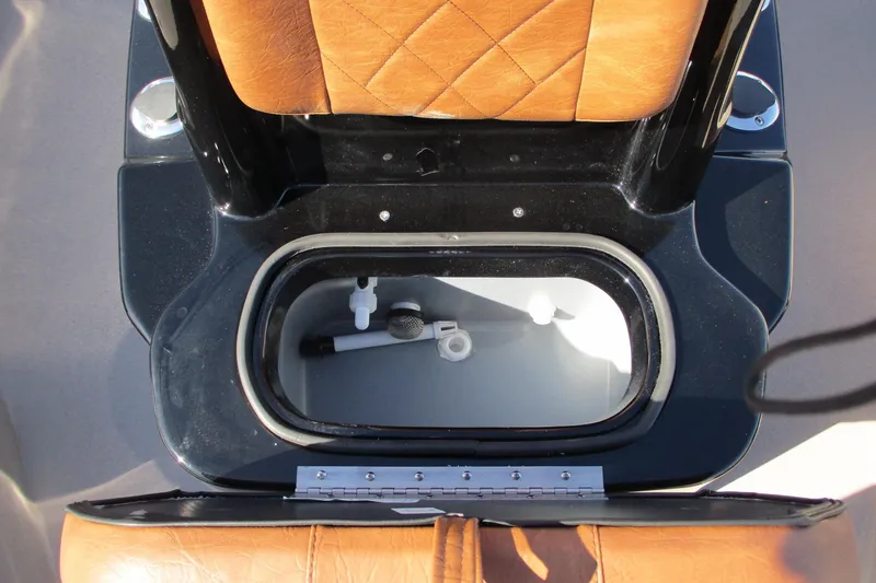 Slide: The Image of 2026 Avid 207 Recon boat seat with storage compartment, featuring tan leather upholstery. - 13