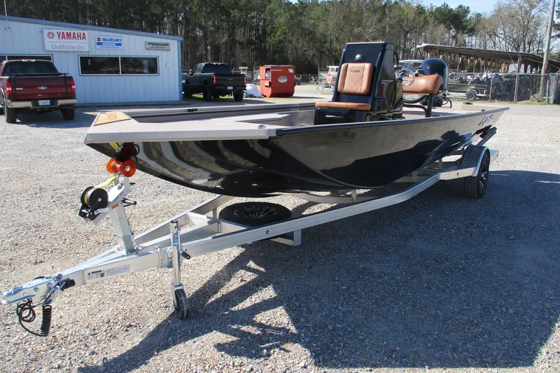 Slide: The Image of 2026 Avid 207 Recon boat on trailer in outdoor dealership lot. - 2