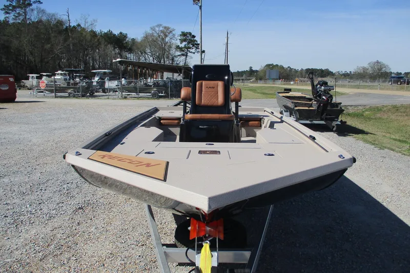 Slide: The Image of Avid 207 Recon 2026 boat on trailer, parked outdoors, showcasing sleek design. - 3