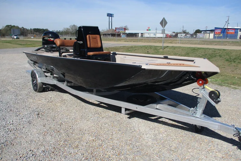 Slide: The Image of Avid 207 Recon 2026 boat on trailer, parked outdoors in a commercial area. - 4