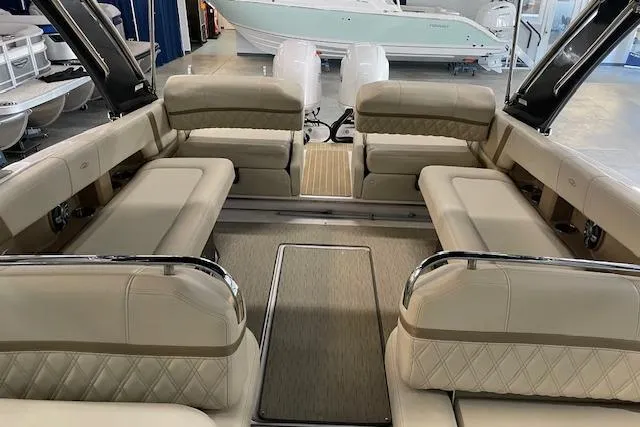 Slide: The Image of 2019 Regal 29 OBX boat interior with luxurious beige seating and spacious layout. - 12