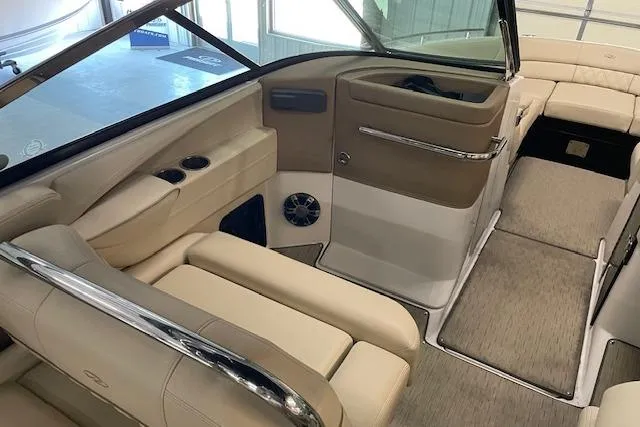 Slide: The Image of Interior of a 2019 Regal 29 OBX boat with beige seating and modern design. - 13