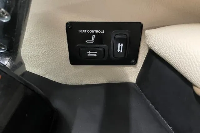 Slide: The Image of 2019 Regal 29 OBX seat controls panel with adjustment buttons. - 17