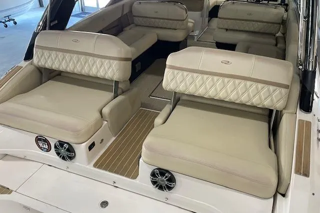 Slide: The Image of Luxurious interior of a 2019 Regal 29 OBX boat with beige seating. - 19