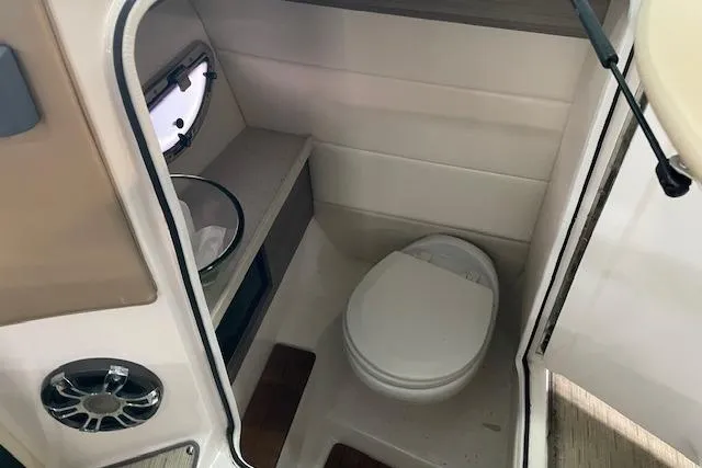 Slide: The Image of 2019 Regal 29 OBX boat interior bathroom with toilet and sink. - 21