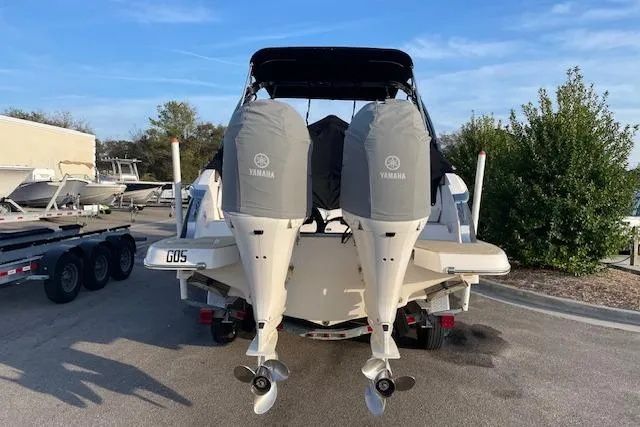 Slide: The Image of 2019 Regal 29 OBX boat with twin Yamaha outboard engines, parked on a trailer. - 6