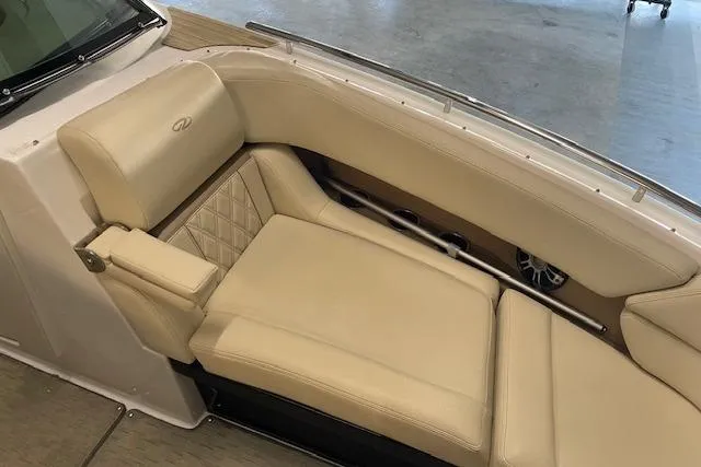Slide: The Image of 2019 Regal 29 OBX boat interior with beige leather seating and elegant design. - 8