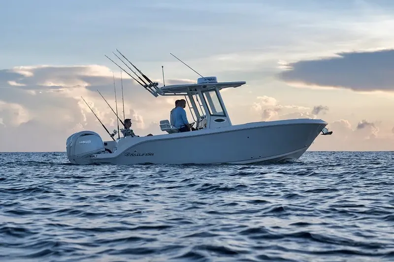 The Image of A 2026 Sailfish 252 CC boat cruising on calm waters at sunset. - 3