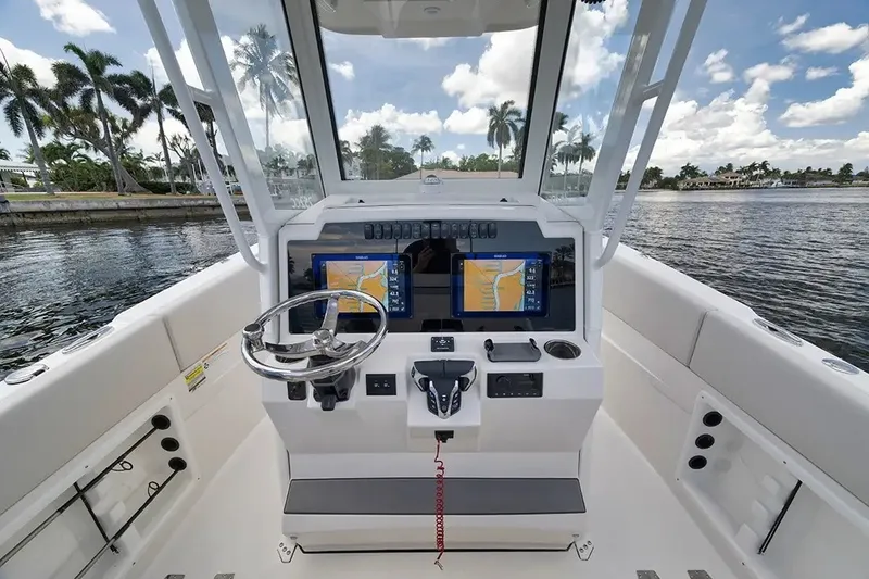 Slide: The Image of The image shows the cockpit of a 2026 Sailfish 252 CC boat with modern navigation systems. - 20