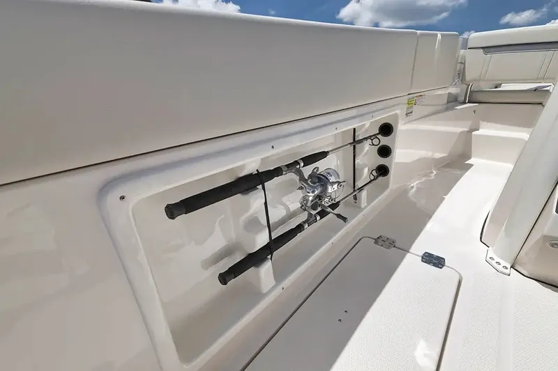 Slide: The Image of The 2026 Sailfish 252 CC features an integrated fishing rod holder on the side wall. - 19