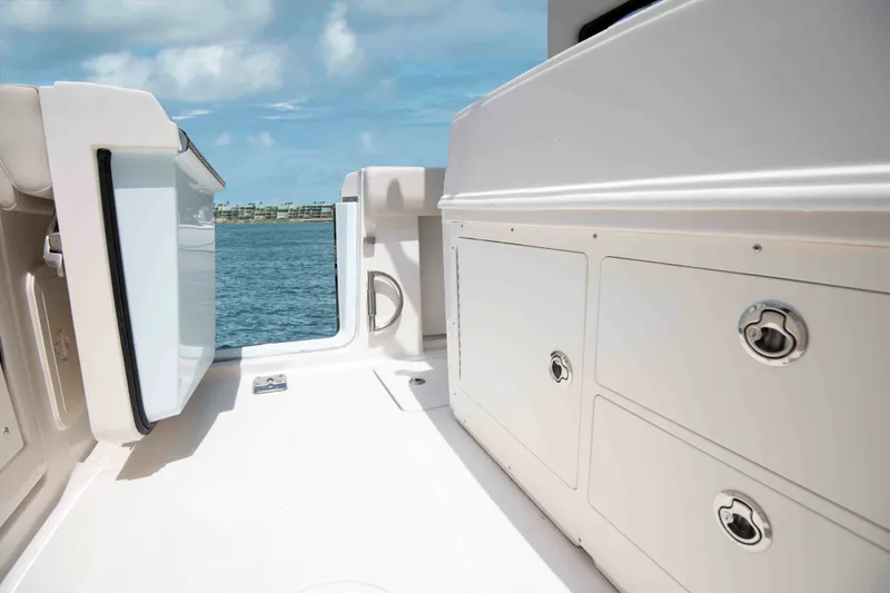 Slide: The Image of Interior view of 2026 Sailfish 272 CC with storage compartments. - 2