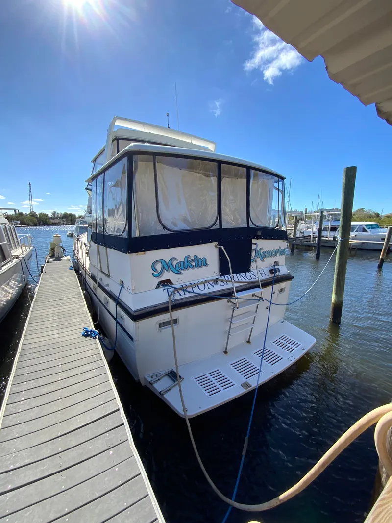 Slide: The Image of 1987 President 41 Double Cabin docked under sunny skies. - 11