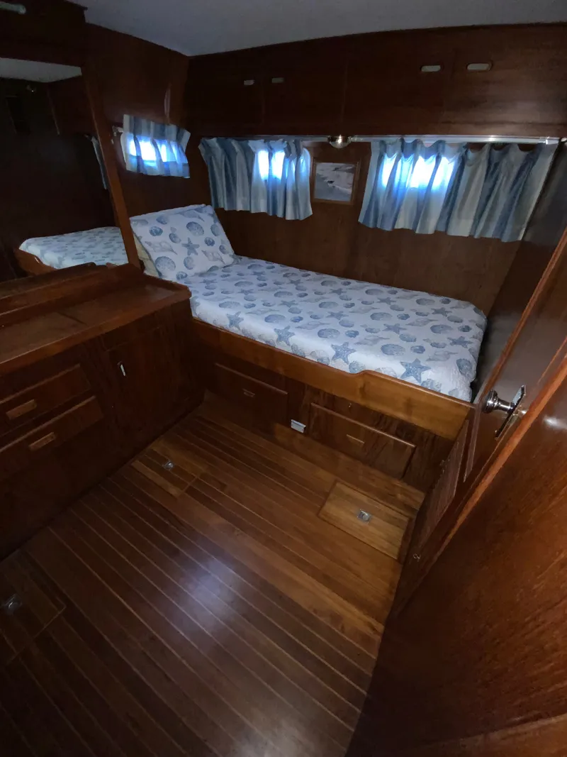 Slide: The Image of Interior of a 1987 President 41 Double Cabin yacht with wooden flooring. - 39