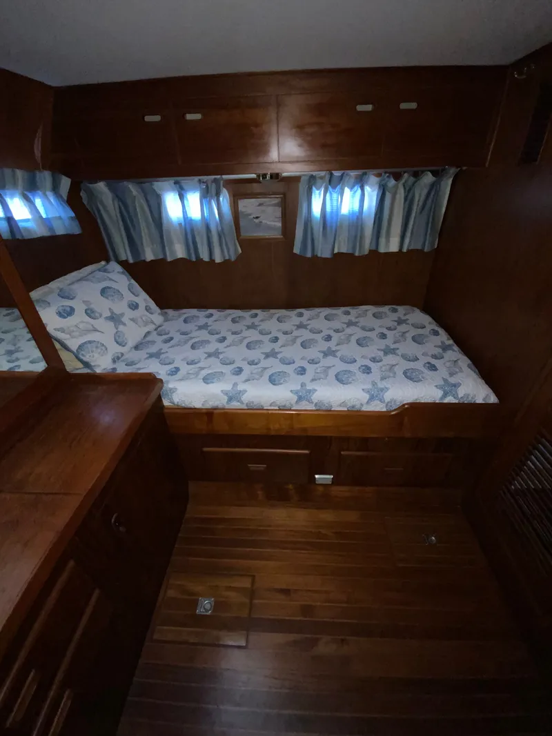 Slide: The Image of Interior of a 1987 President 41 Double Cabin yacht with wooden furnishings. - 44