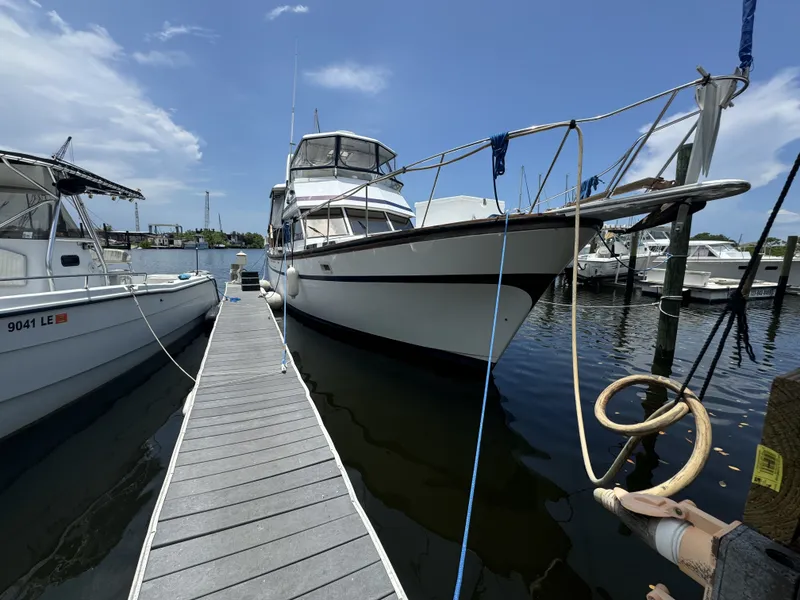 Slide: The Image of 1987 President 41 Double Cabin yacht docked at marina. - 8