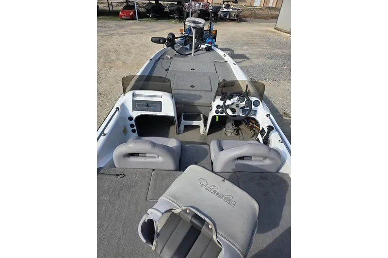 Slide: The Image of 2001 Bass Cat Cougar boat interior with steering wheel and seating. - 11