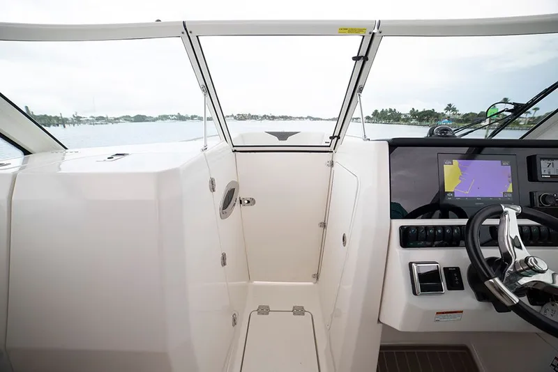 Slide: The Image of Interior view of 2026 Sailfish 276 DC boat with helm console. - 3
