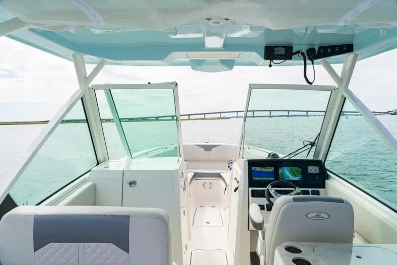 Slide: The Image of The image shows the cockpit of a 2026 Sailfish 276 DC with a modern helm and panoramic view. - 4