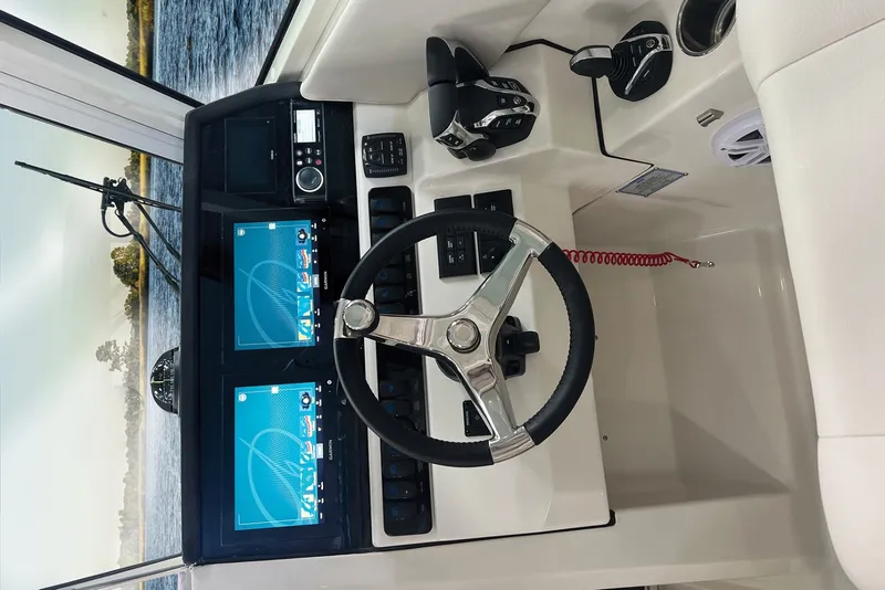 Slide: The Image of The Sailfish 276 DC cockpit features a modern steering wheel with two screens and controls. - 8
