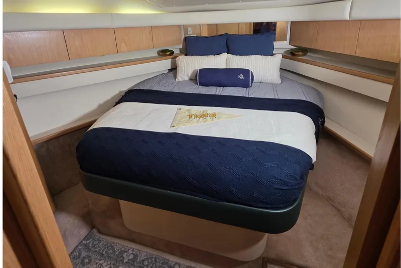 Slide: The Image of Interior of 1997 Tiara Yachts 4000 Express with cozy bed. - 18