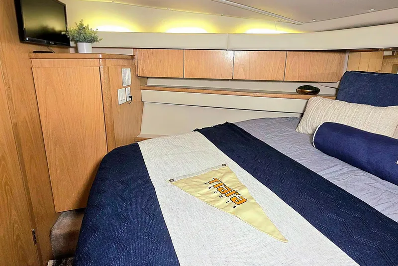 Slide: The Image of Interior of 1997 Tiara Yachts 4000 Express with bed and TV. - 19