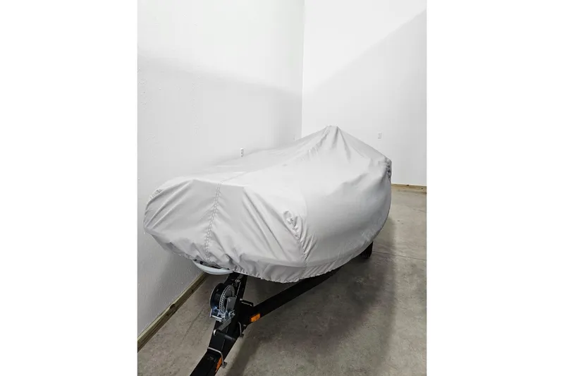 Slide: The Image of Covered 1997 Tiara Yachts 4000 Express on trailer in indoor storage. - 23