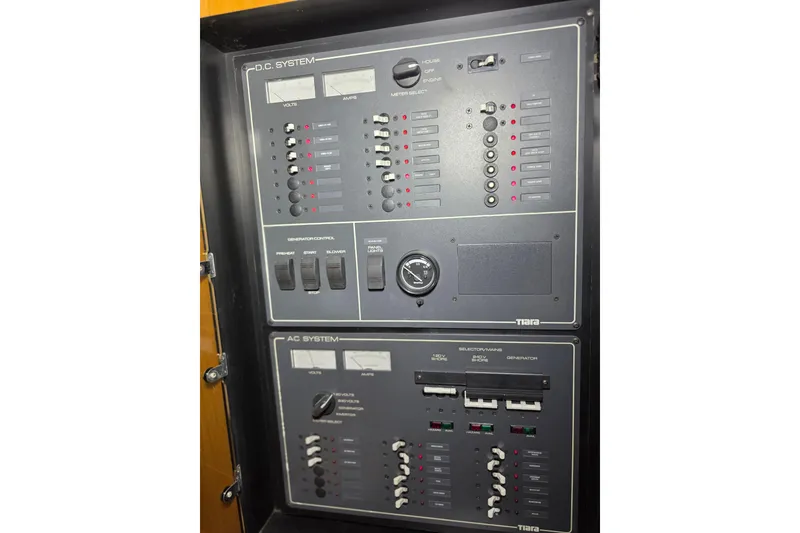 Slide: The Image of Electrical control panel of a 1997 Tiara Yachts 4000 Express boat. - 24