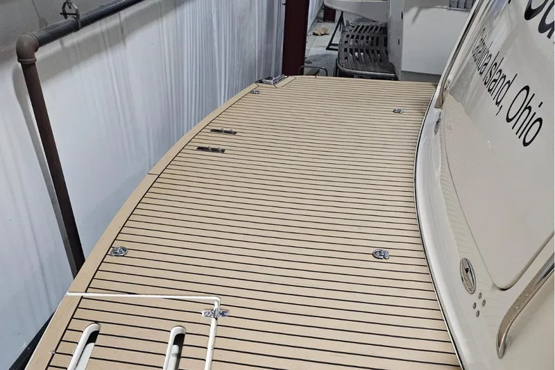 Slide: The Image of 1997 Tiara Yachts 4000 Express boat deck with wood finish, docked in Ohio. - 6