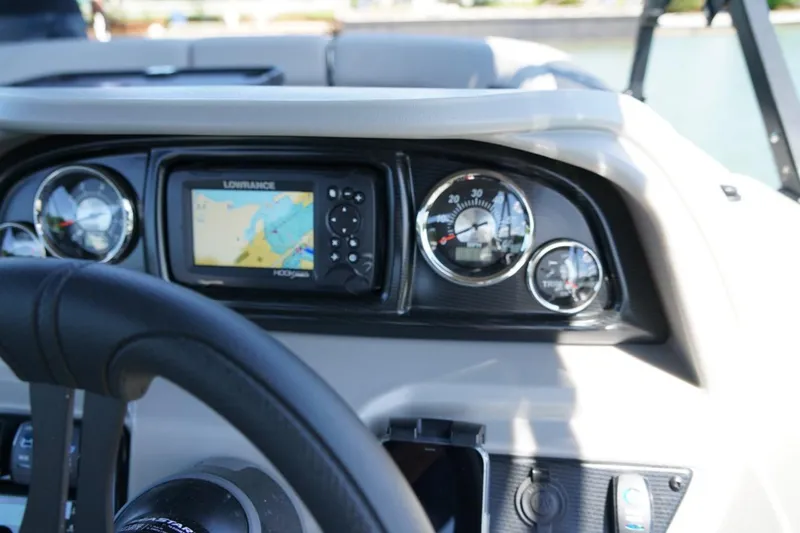 Slide: The Image of Dashboard of 2026 Berkshire 24 RFX LE boat with navigation system and gauges. - 11