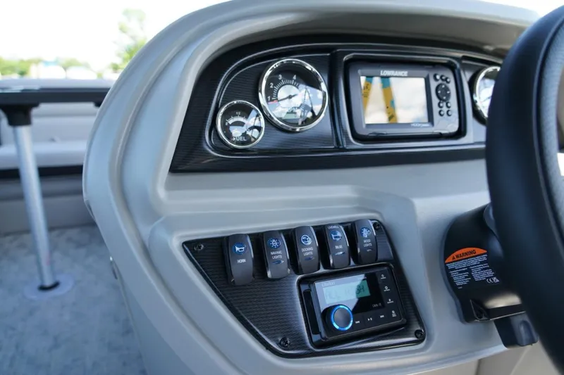 Slide: The Image of Dashboard of 2026 Berkshire 24 RFX LE boat with gauges and controls. - 12