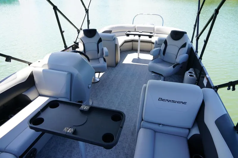 Slide: The Image of Interior of 2026 Berkshire 24 RFX LE pontoon boat with luxurious seating and table. - 13