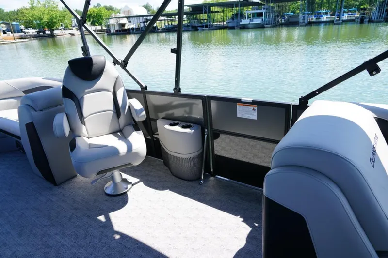 Slide: The Image of Luxurious seating on 2026 Berkshire 24 RFX LE pontoon boat by the water. - 17