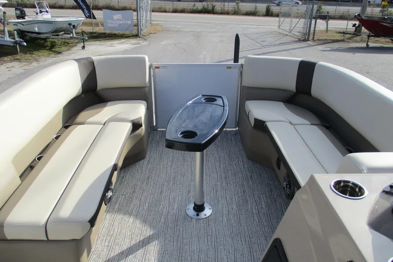 Slide: The Image of 2026 SunCatcher Select 22SL pontoon boat interior with seating and table. - 10