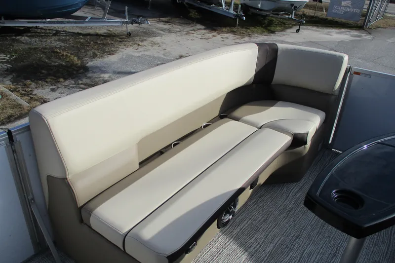 Slide: The Image of Luxurious seating on 2026 SunCatcher Select 22SL pontoon boat, featuring beige upholstery. - 11