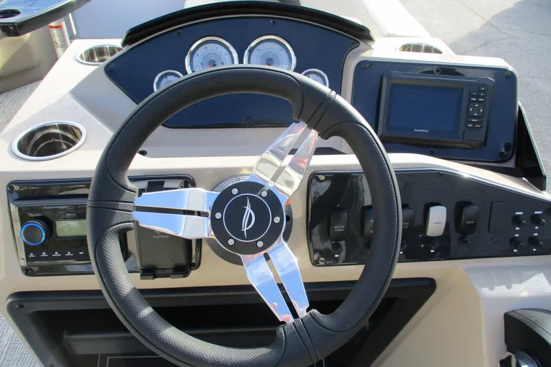 Slide: The Image of Steering console of 2026 SunCatcher Select 22SL boat with modern controls and gauges. - 28