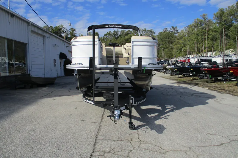 Slide: The Image of 2026 SunCatcher Select 22SL pontoon boat on trailer, outdoor dealership setting. - 4