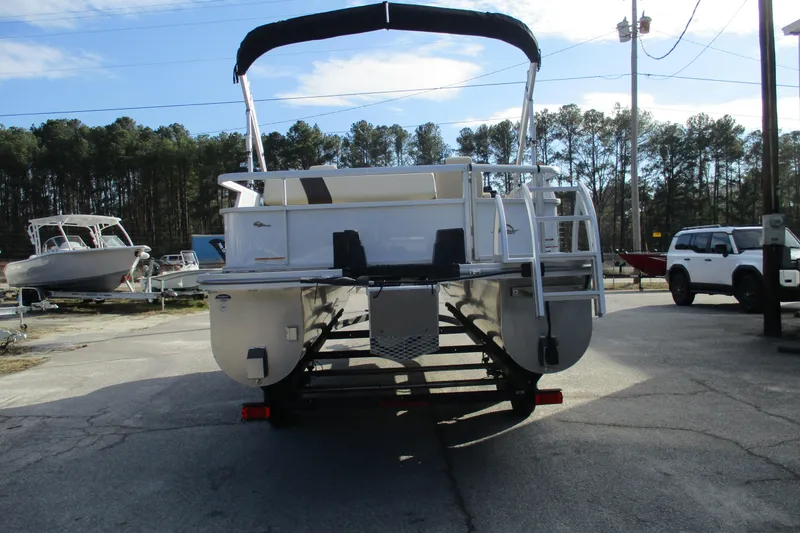 Slide: The Image of 2026 SunCatcher Select 22SL pontoon boat on trailer, parked outdoors. - 8