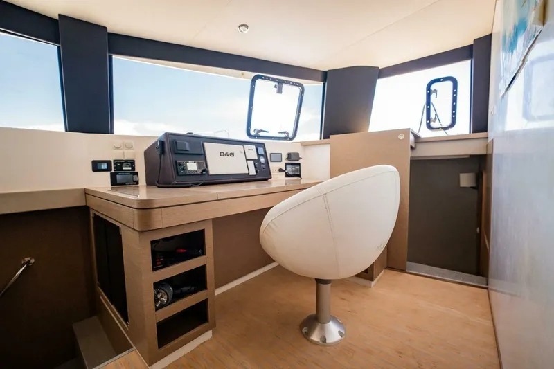 Slide: The Image of Modern NEEL 51 yacht interior with navigation equipment and stylish seating, 2020 model. - 15