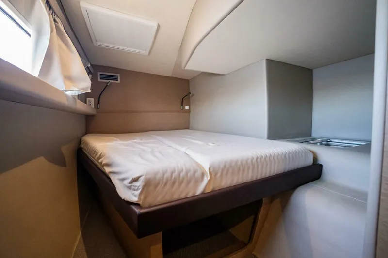 Slide: The Image of Cozy cabin interior of 2020 NEEL 51 trimaran with comfortable bed and window. - 20